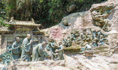 Cliff stone carvings on the half-mountain side of Emei Mountain, Sichuan Province, China