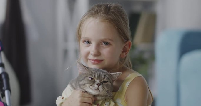 Girl holding a cat