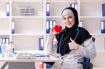 Young doctor in hijab working in the clinic