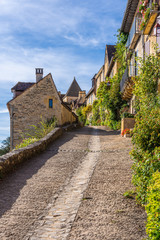 Fototapeta na wymiar Pretty street in the medieval village of Beynac-et-Cazenac in the historic Perigord region of France