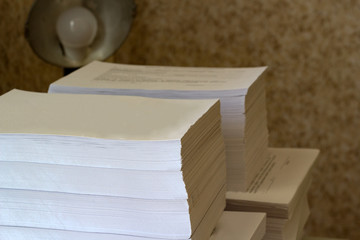 Printed sheets of paper are folded (after printing). View from the corner of the pack