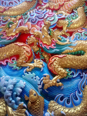 The walls are decorated with Chinese art, Chinese dragon in a Chinese temple .
