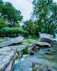 Lake view, stones, and trees at Claredon Beach Park Keswick Ontario Canada