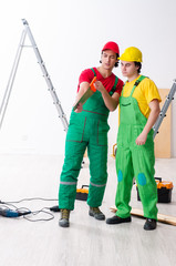 Obraz na płótnie Canvas Two workers contractors working indoors