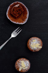 chocolate muffins on dark blue background, top view