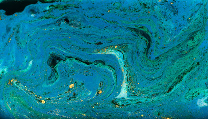Blue, green and gold marbling pattern. Golden powder marble liquid texture.