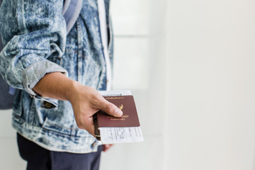 Closeup of Man holding passports and boarding pass,Business travel concept