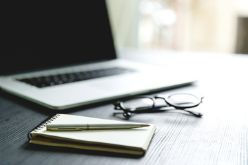 Workspace for working on table with labtop background