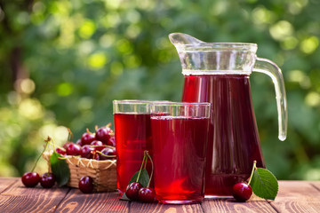 cherry juice in glasses and jug