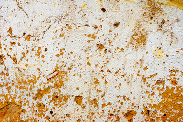 Texture of a concrete wall with cracks and scratches which can be used as a background