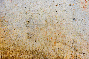 Texture of a concrete wall with cracks and scratches which can be used as a background