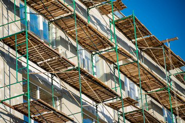 scaffolding near the building during the restoration outdoor wall decor