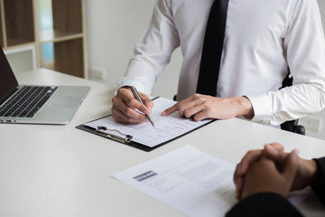 Executives are interviewing job applicants and preliminary background checks, candidates are talking about their past work experience, personal managers make hiring decisions.