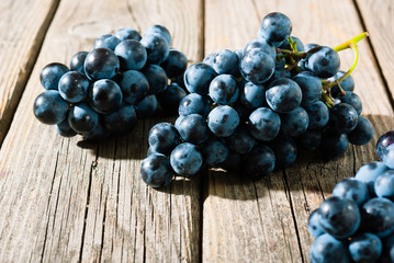 red grapes on old weathered wooden table