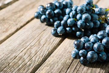 red grapes on old weathered wooden table