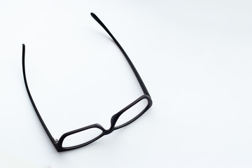 Black-rimmed glasses on a white background