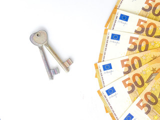 50 euro bills for house keys isolated on white background. Rent concept