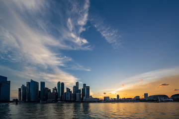 The Central Business District and Marina Bay skyline at dusk in Singapore