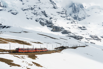 Tourist train to Jungfraujoch (Top of Europe) mountain with side way full of snow
