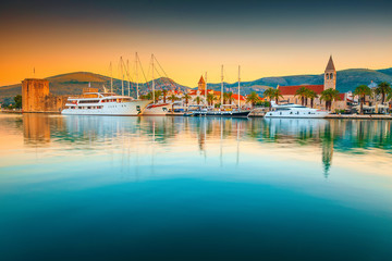 Trogir old town and harbor with boats at sunrise, Croatia