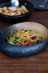 Spaghetti bacon spicy in the black bowl
