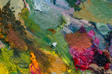 Fototapeta na wymiar Close up palette with oil paints. Abstract background.