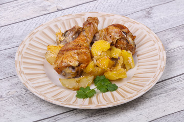 Roasted chicken legs with potato