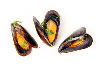 Cooked mussels, shot from the top on a white background, a flat lay composition - obrazy, fototapety, plakaty