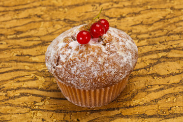 Sweet tasty muffin with red currants