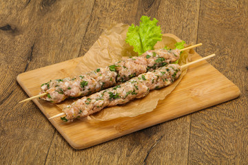 Raw minced pork skewer kebab for grill
