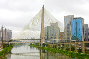 Sao Paulo cityscape landmark Estaiada Bridge reflex in Pinheiros river, Sao Paulo, Brazil