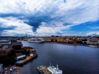 Naklejka premium Panorama of the city, river and ship, view from quadrocopter drone flight