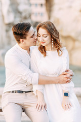 Fototapeta premium Beautiful stylish pair of in the European style. Wedding photo shoot on the streets of Rome.