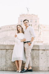 Fototapeta premium Beautiful stylish pair of in the European style. Wedding photo shoot on the streets of Rome.