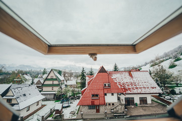 View into the window wooden roofs of houses in Zakopane. Poland