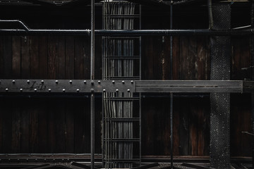 Industrial exposed ceiling with timber boards, steel beams and exposed wiring. Textured background graphic asset.