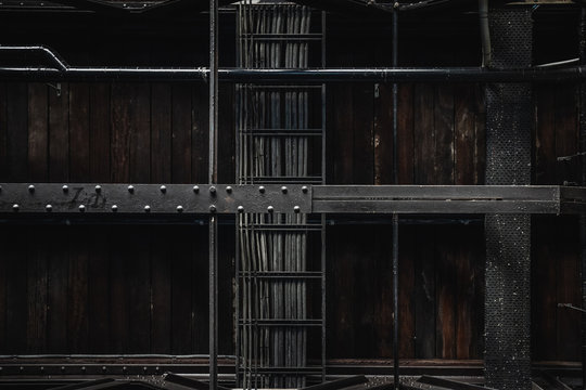 Industrial Exposed Ceiling With Timber Boards, Steel Beams And Exposed Wiring. Textured Background Graphic Asset.