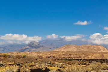 View of the valley and hills under blue sky