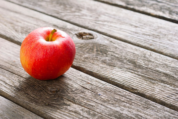apple on old wood table