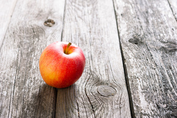 apple on old wood table