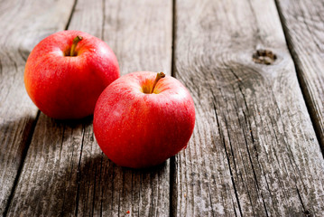 two apples on old wood table
