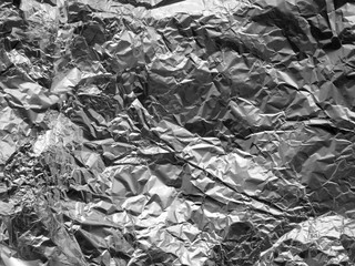 Texture of old crumpled aluminium food foil background