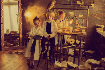 adorable little scientists with owl working in chemistry laboratory