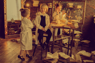 smiling small researchers studying chemistry in the class