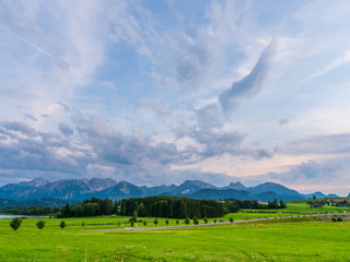 Lake with clouds and mountains in the evening