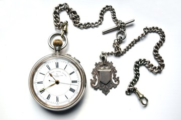 Old pocket watch with chain isolated on white