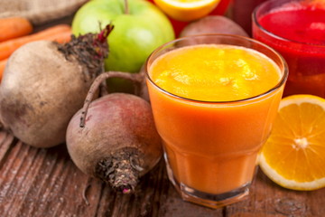 Smoothie from beetroot, lemon, grapefruit, carrots and apples. Fresh, healthy and homemade.