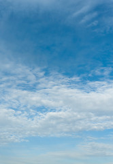 Beautiful spring blue sky with clouds altocumulus in Fuji City, Japan. Vertical shot.
