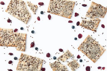 White background with grain cookies fresh blueberries, dried cranberries. Useful snack, proper nutrition. Healthy breakfast. Food for vegans.