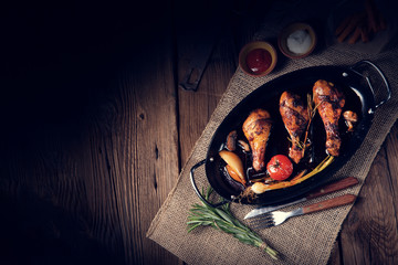 grilled chicken legs in barbecue marinade with sweet potatoes